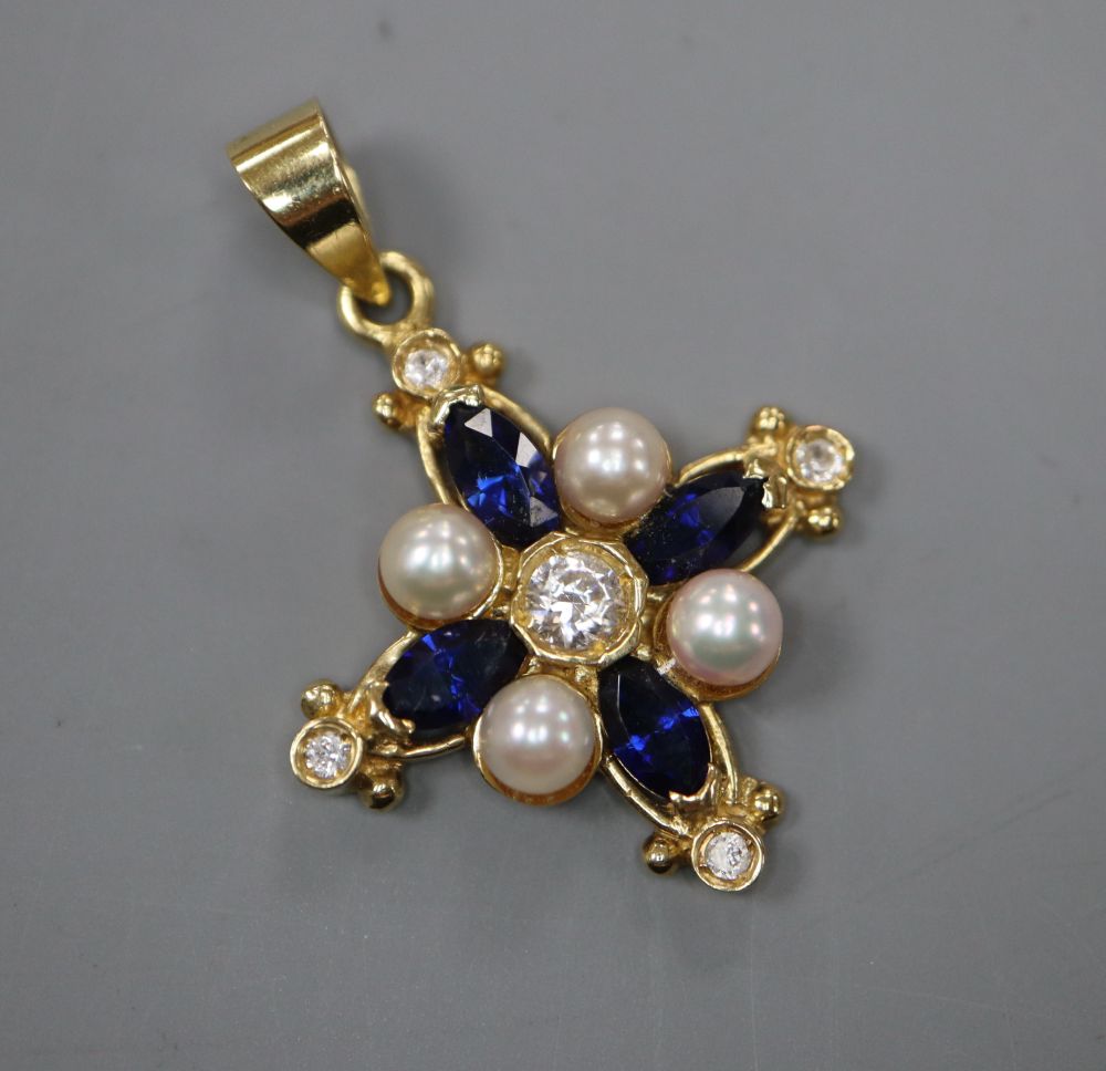 A modern 750 yellow metal, white and blue sapphire and cultured pearl set star pendant, 23mm, gross 4.3 grams.